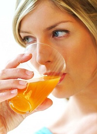 ADEMXK Close-up of woman drinking orange juice